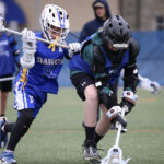 Dawgs in action, player competing for ground ball