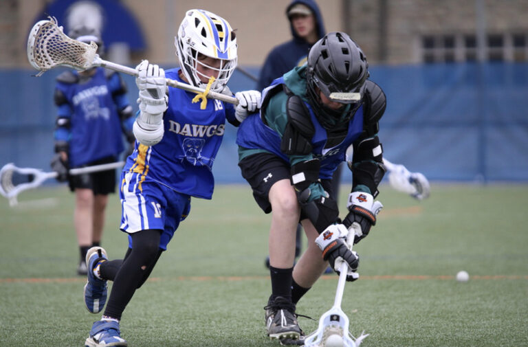 Dawgs in action, player competing for ground ball