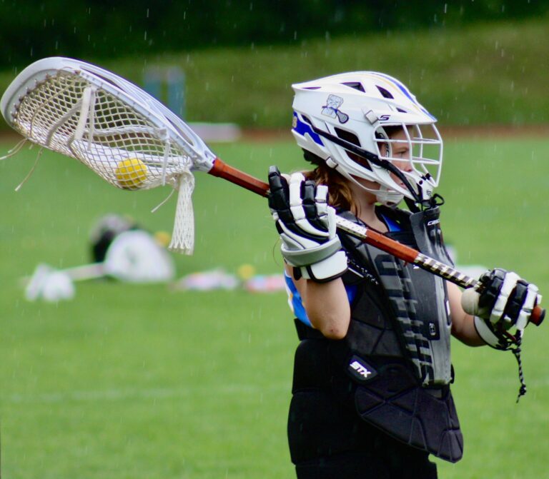 Dawgs Girls lacrosse club goalie clearing ball